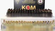 Milas polisinden kaçak içki darbesi: Şüpheli araçta 144 litre alkol yakalandı