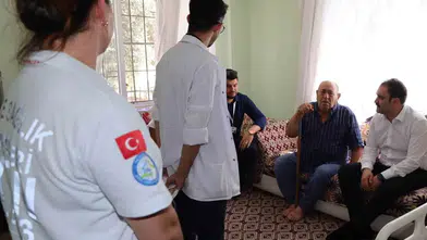 Karacasu’da Evde Sağlık Seferberliği: Kaymakam Battal Hasta Yatağında Dinledi